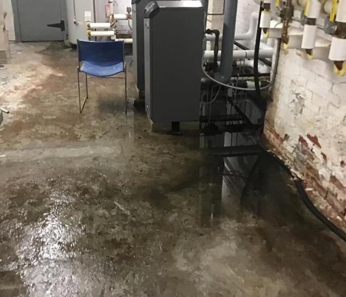 a concrete floor covered in sewage