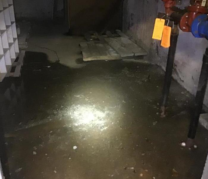 the interior of a building flooded with sewage