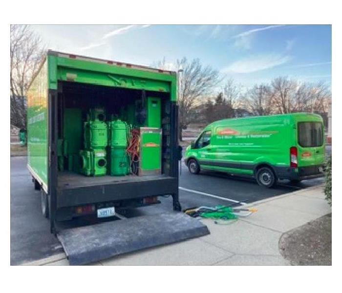 SERVPRO vehicles parked on at a commercial loss.